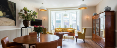Gemeenschappelijke woonkamer bij Villa de Maere